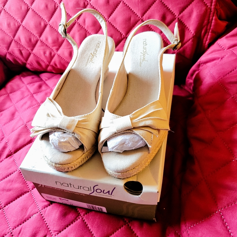 Beige open toe, wedge heel, sandals.